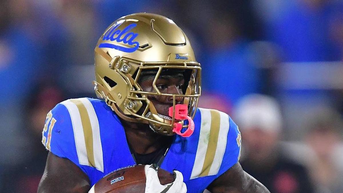  Nov 8, 2025; Pasadena, California, USA; UCLA Bruins running back Jaivian Thomas (21) runs the ball against the Nebraska Cornhuskers during the first half at the Rose Bowl. Mandatory Credit: Gary A. Vasquez-Imagn Images | Gary A. Vasquez-Imagn Images 