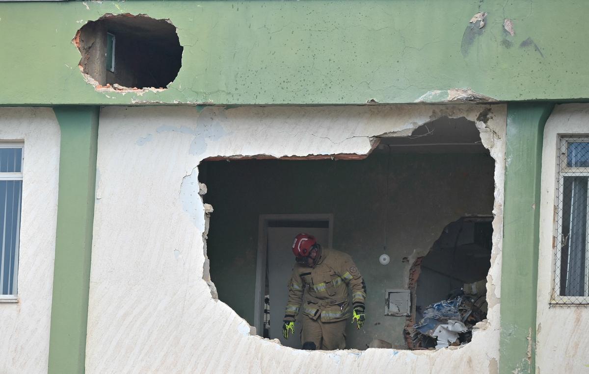 A firefighter works after a plane crashed into a building in Belo Horizonte, Brazil, May 4, 2026. REUTERS/Washington Alves