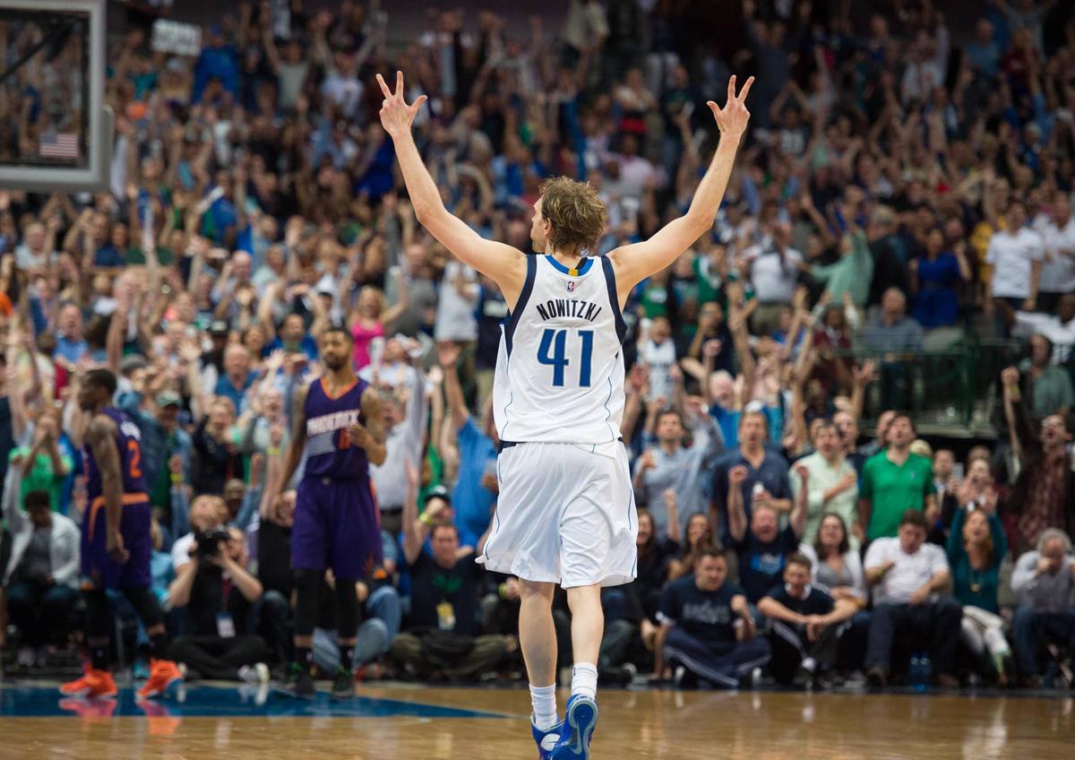  Dallas Mavericks forward Dirk Nowitzki celebrates his 3-point basket against the Phoenix Suns at the American Airlines Center. Jerome Miron-Imagn Images