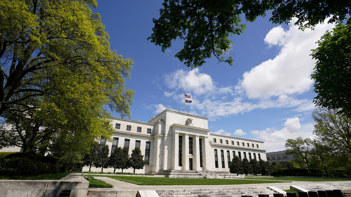 FILE PHOTO: The Federal Reserve building is set against a blue sky in Washington, U.S., May 1, 2020. REUTERS/Kevin Lamarque/File Photo