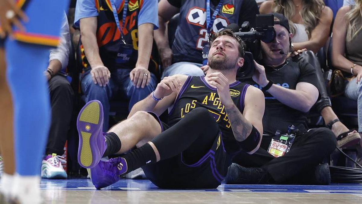  Apr 2, 2026; Oklahoma City, Oklahoma, USA; Los Angeles Lakers guard Luka Doncic (77) falls to the court during a play against the Oklahoma City Thunder during the third quarter at Paycom Center. Mandatory Credit: Alonzo Adams-Imagn Images | Alonzo Adams-Imagn Images 