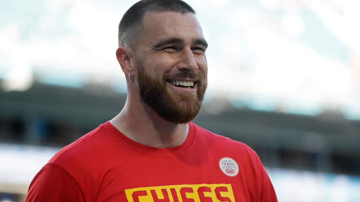 FILE - Kansas City Chiefs’ Travis Kelce smiles before the NFL Super Bowl 54 football game between the San Francisco 49ers and Kansas City Chiefs in Miami Gardens Fla., in this Sunday, Feb. 2, 2020, file photo. Seattle’s star quarterback Russell Wilson and Kansas City’s standout tight end Travis Kelce are among the 32 finalists for the Walter Payton NFL Man of the Year award. (AP Photo/Wilfredo Lee, File)