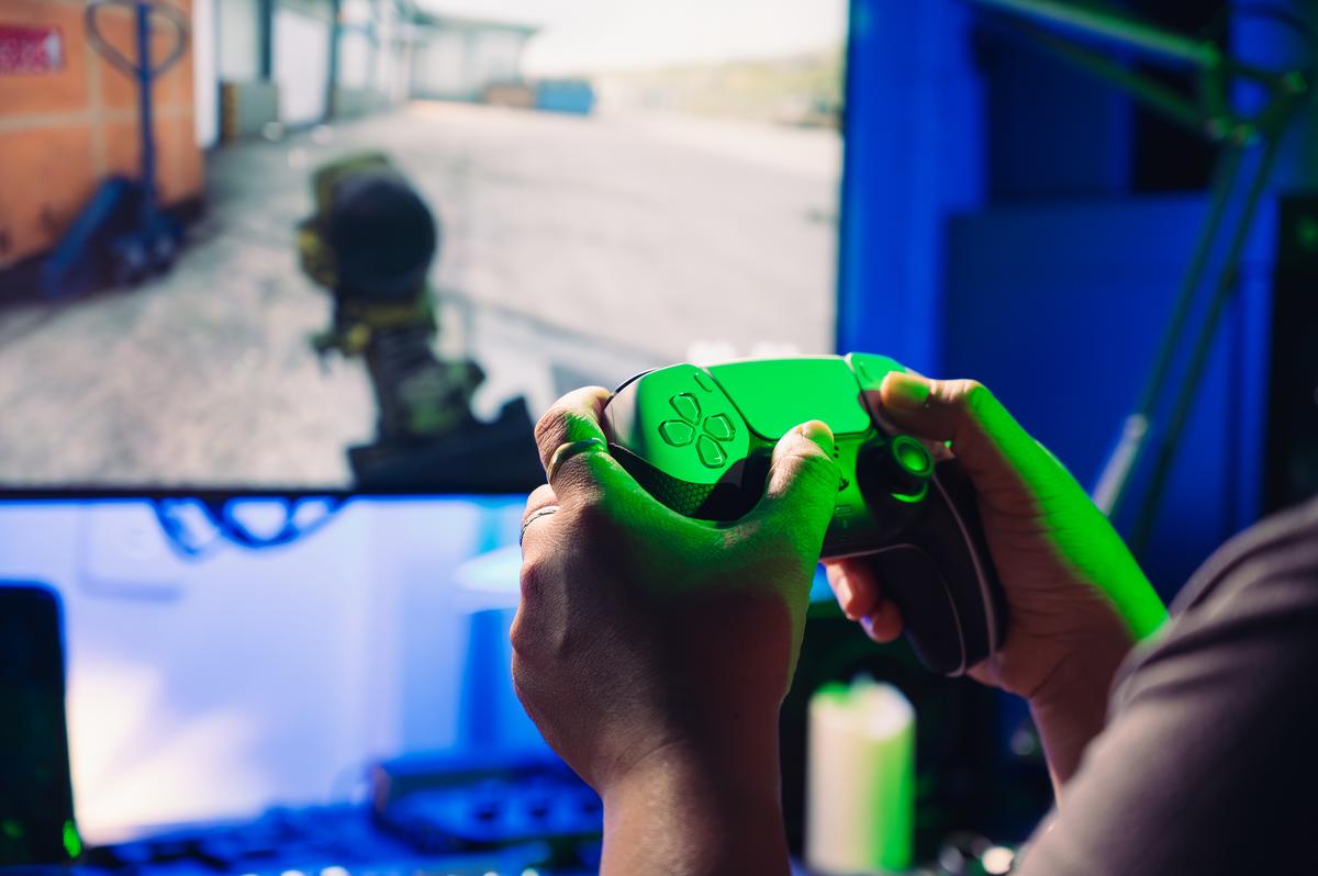  Bangkok, Thailand – 2 December 2023: the close-up image of the PlayStation 5 joystick or game’s controller on the gaming table. 