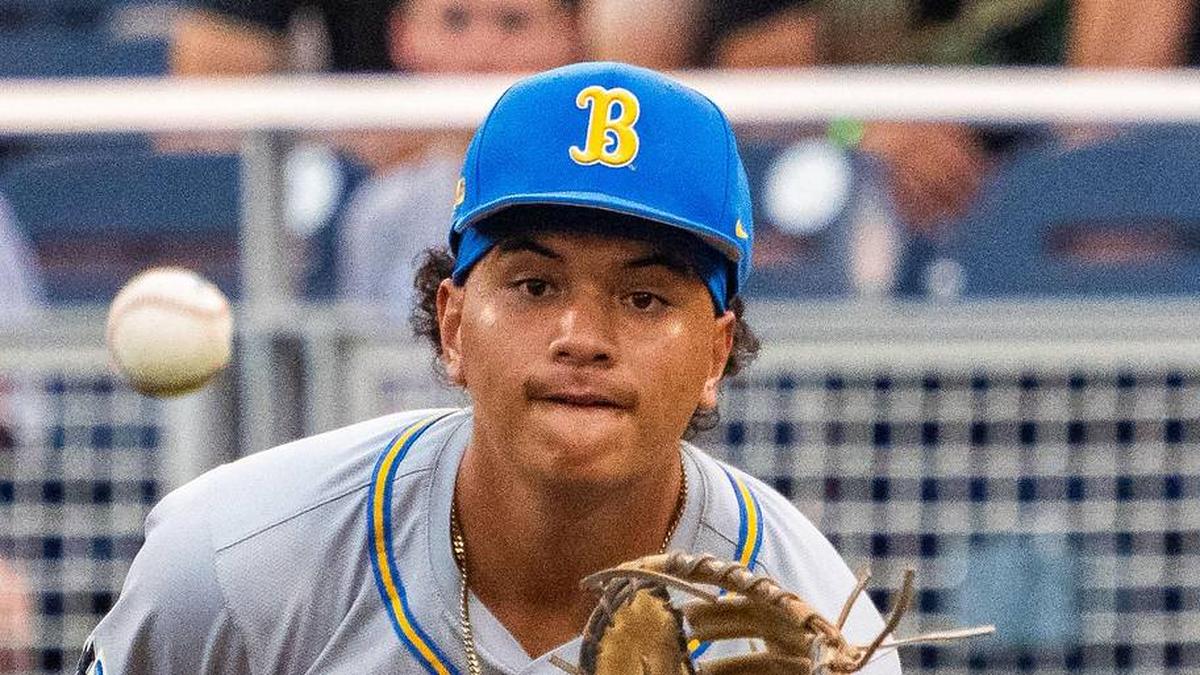  Jun 17, 2025; Omaha, Neb, USA; UCLA Bruins first baseman Mulivai Levu (39) catches for an out against the Arkansas Razorbacks during the first inning at Charles Schwab Field. Mandatory Credit: Dylan Widger-Imagn Images | Dylan Widger-Imagn Images 