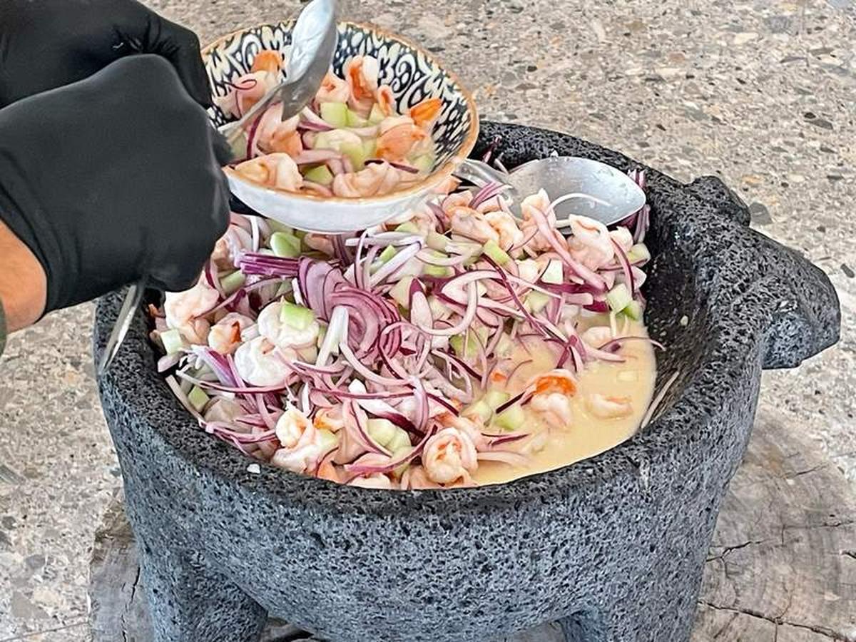  Making ceviche at the GM's Table in a molcajete, made from volcanic stone, recognizable by its three short legs. Photo credit: Merle Rosenstein 