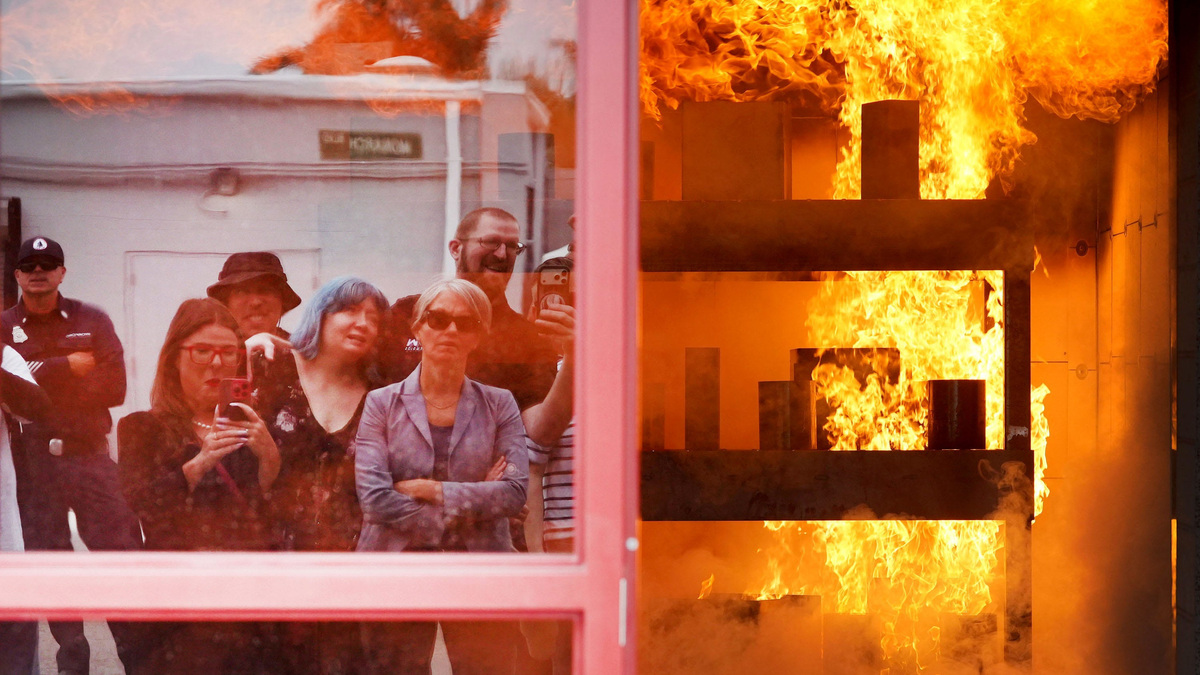 A large group tours the Ventura County Fire Department’s $32.5 million live-fire training facility on June 24. In this demonstration, the scenario simulates a kitchen fire at a strip mall.