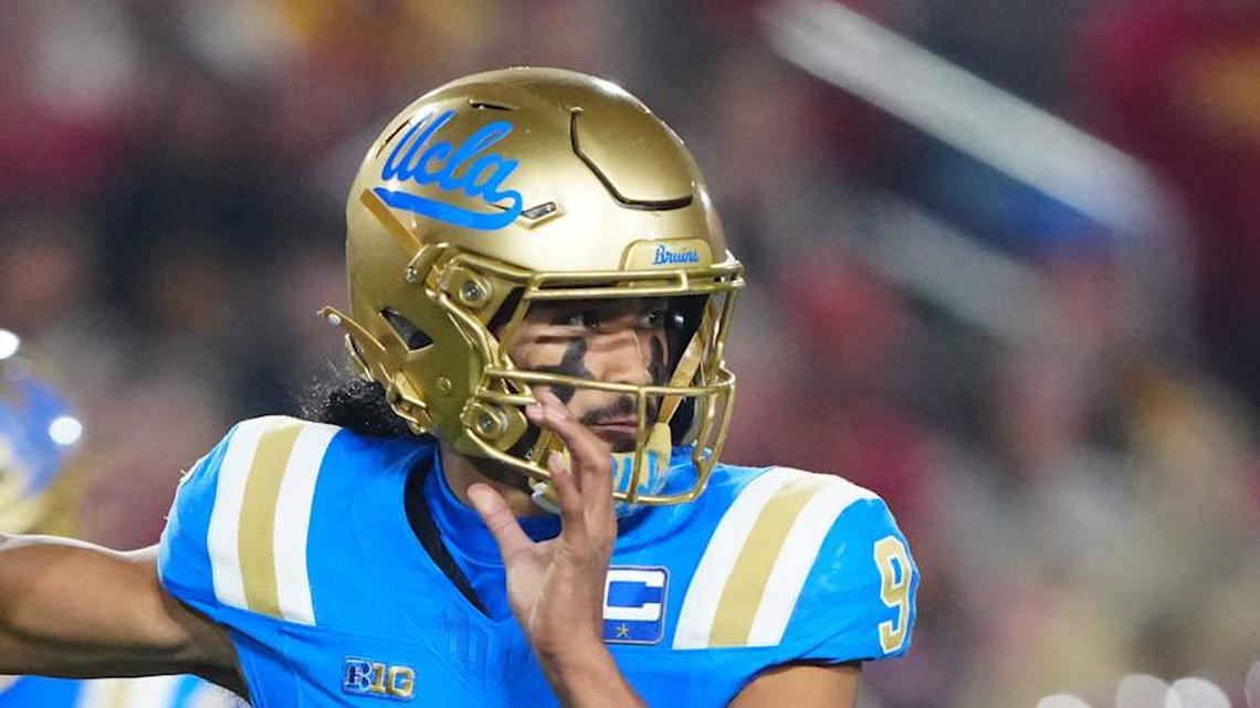  Nov 29, 2025; Los Angeles, California, USA; UCLA Bruins quarterback Nico Iamaleava (9) throws the ball against the Southern California Trojans in the first half at United Airlines Field at Los Angeles Memorial Coliseum. Mandatory Credit: Kirby Lee-Imagn Images | Kirby Lee-Imagn Images 