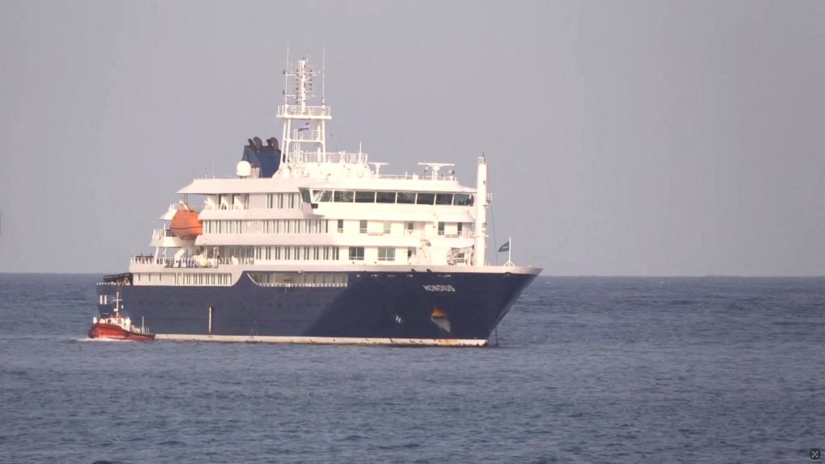 A boat beside cruise ship MV Hondius anchored off Cape Verde port, on the day sick passengers were evacuated by boat from the cruise ship, in Praia Port, Cape Verde, in this screengrab obtained from a video, May 5, 2026. REUTERS TV via REUTERS