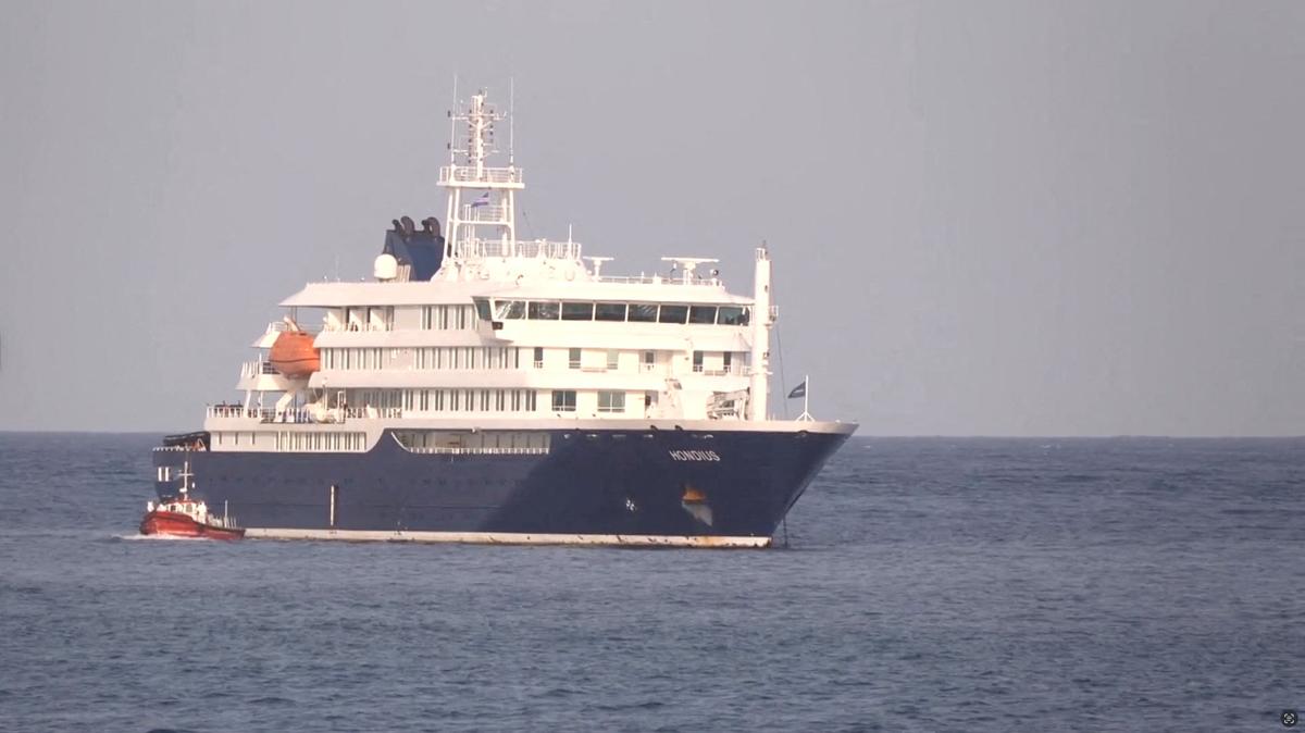 A boat beside cruise ship MV Hondius anchored off Cape Verde port, on the day sick passengers were evacuated by boat from the cruise ship, in Praia Port, Cape Verde, in this screengrab obtained from a video, May 5, 2026. REUTERS TV via REUTERS