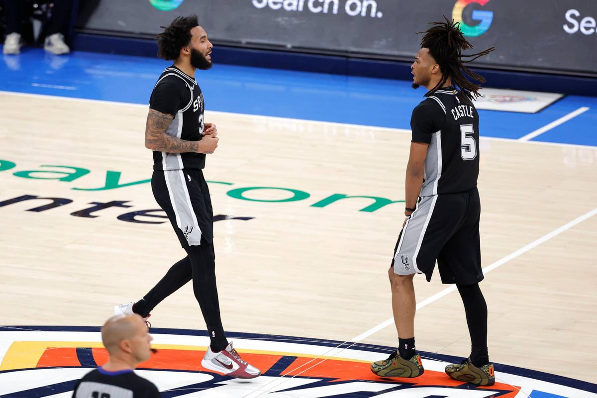  May 30, 2026; Oklahoma City, Oklahoma, USA; San Antonio Spurs forward Julian Champagnie (30) and guard Stephon Castle (5) react in the third quarter against the Oklahoma City Thunder during game seven of the western conference finals for the 2026 NBA playoffs at Paycom Center. Mandatory Credit: Alonzo Adams-Imagn Images 