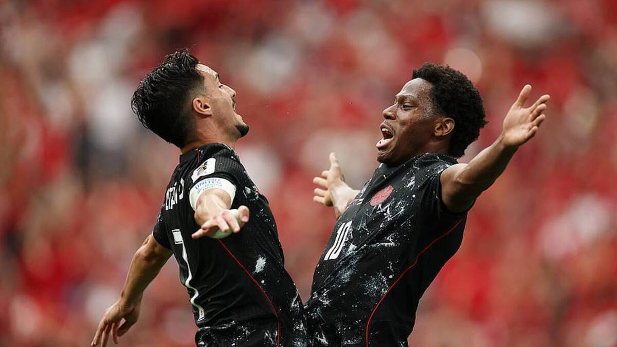  Jonathan David (right) opened his World Cup account. | Jared C. Tilton/FIFA/Getty Images 
