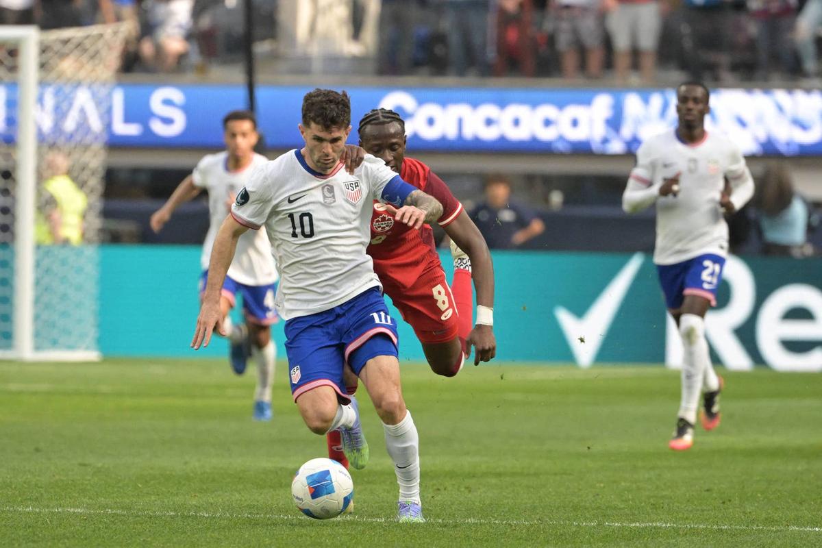  United States forward Christian Pulisic dribbles past Canada midfielder Ismael Kone during the CONCACAF Nations League third-place match in Inglewood, California, on March 23, 2025. Jayne Kamin-Oncea-Imagn Images
