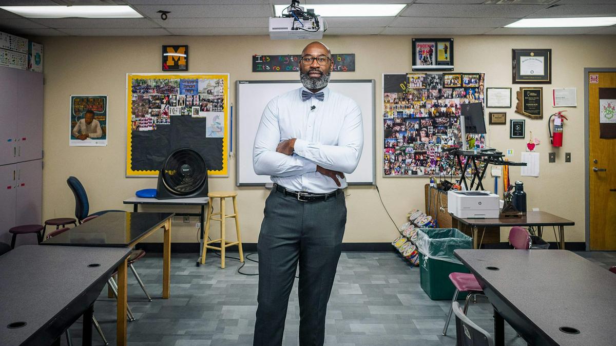 Kareem Neal, a teacher at Maryvale High School in Phoenix, poses in his classroom in October 2022. 
