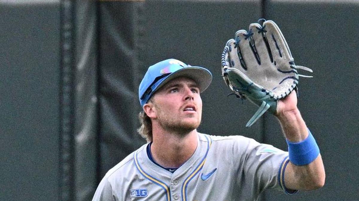  Jun 16, 2025; Omaha, Neb, USA; UCLA Bruins center fielder Payton Brennan (11) catches a fly ball against the LSU Tigers during the second inning at Charles Schwab Field. Mandatory Credit: Steven Branscombe-Imagn Images | Steven Branscombe-Imagn Images 