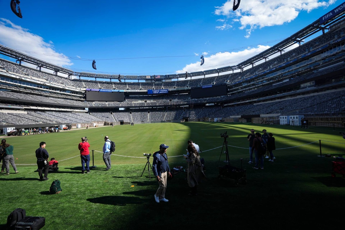  Members of the media document the freshly laid sod at MetLife Stadium, May 7, 2026, East Rutherford, NJ, USA. 