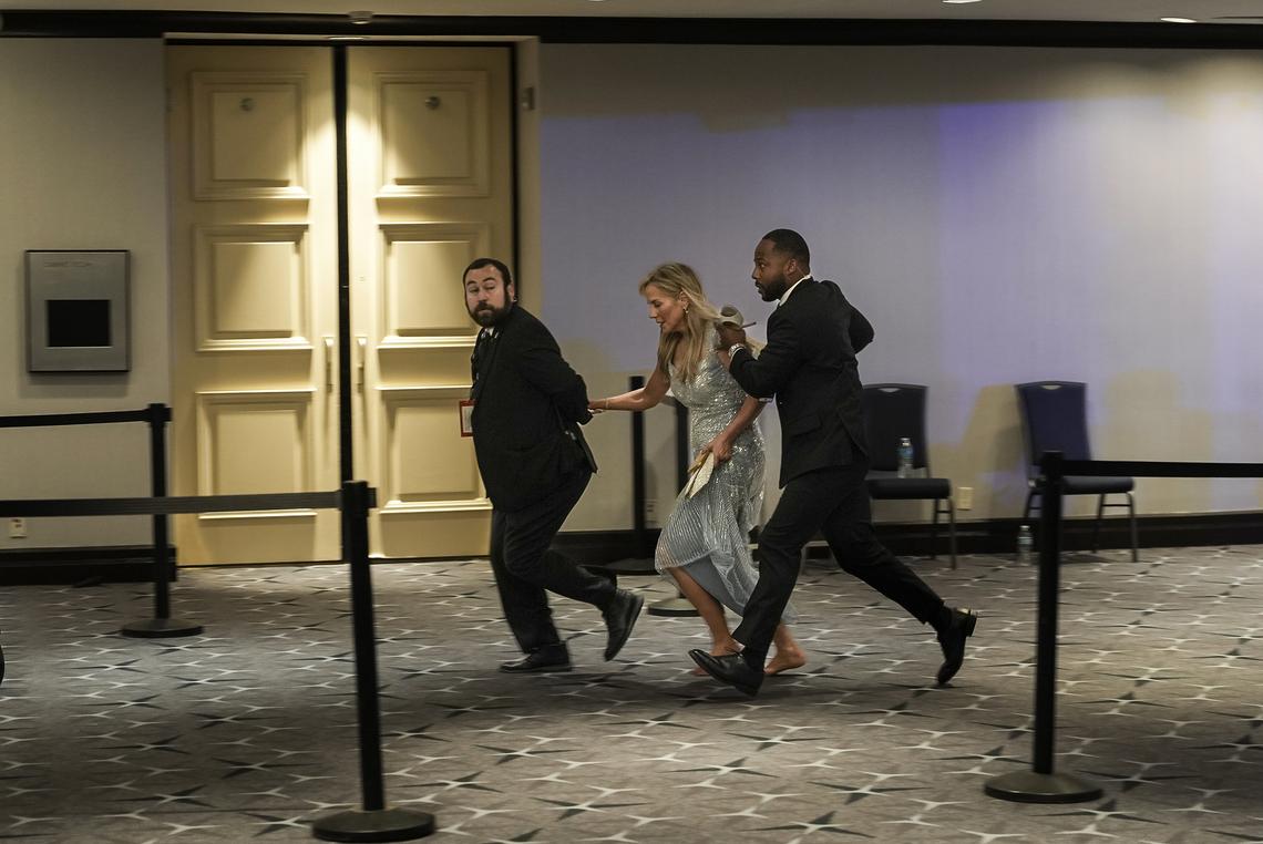 People flee after shots were fired during the 2026 White House Correspondents' Association Dinner at the Washington Hilton in Washington, on April 25, 2026. A sense of danger spread like a wave among high-profile politicians and journalists as an emergency unfolded at the White House Correspondents' Association dinner. (Salwan Georges/The New York Times)