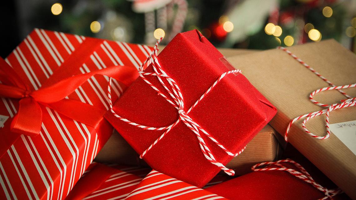 Christmas presents background, red, gold, close up