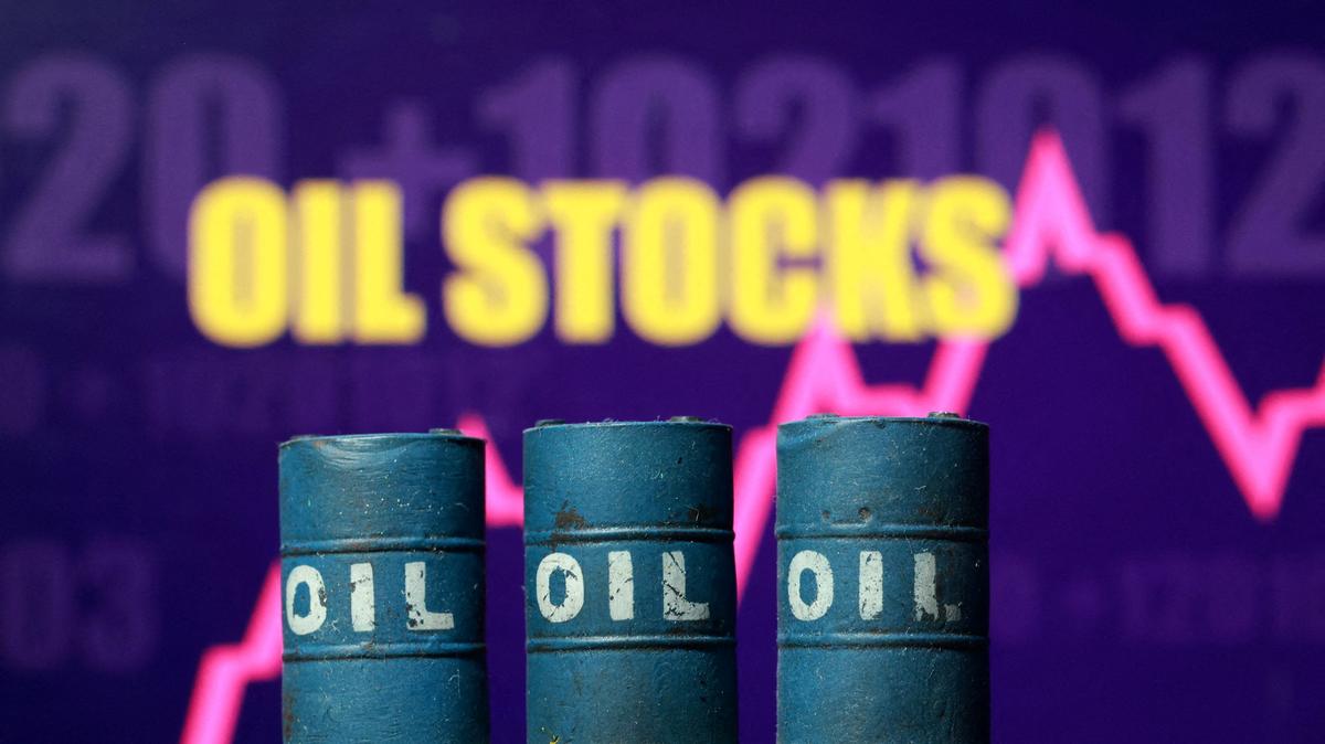 FILE PHOTO: 3D printed oil barrels, rising stock graph and words "Oil Stocks" are seen in this illustration taken March 23, 2026. REUTERS/Dado Ruvic/File Photo
