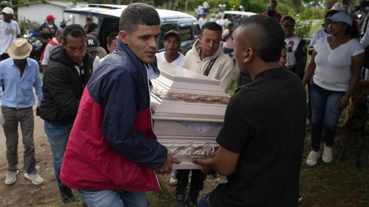 Mourners carry a casket during a funeral procession for victims of the gas-cylinder bomb attack in the La Pedregosa district of Cajibio, Colombia, on Monday. The attack Saturday by suspected FARC dissidents on the Pan-American Highway left at least 19 people dead, according to Colombia's National Institute of Legal Medicine and Forensic Sciences. Photo by ERnesto Guzman Jr./EPA