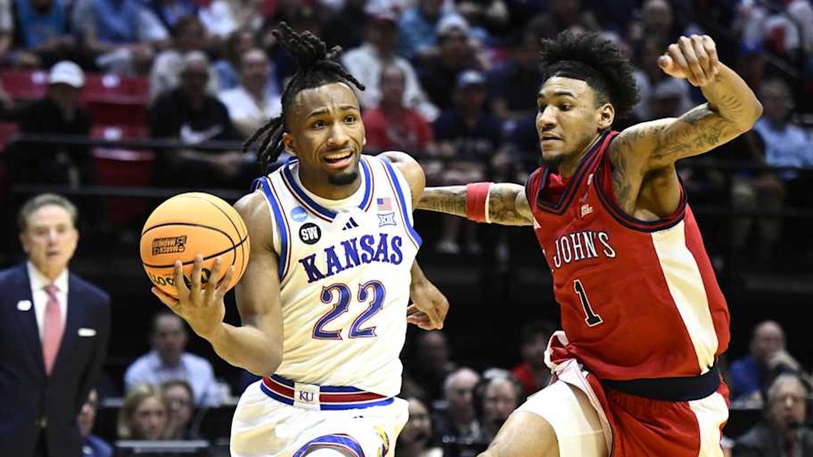  Mar 22, 2026; San Diego, CA, USA; Kansas Jayhawks guard Darryn Peterson (22) controls the ball against St. John's Red Storm forward Dillon Mitchell (1) in the first half during a second round game of the men's 2026 NCAA Tournament at Viejas Arena. Mandatory Credit: Denis Poroy-Imagn Images | Denis Poroy-Imagn Images 