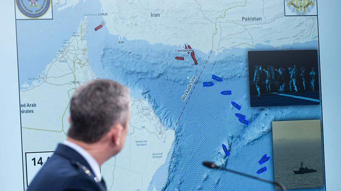 Chairman of the Joint Chiefs of Staff General Dan Caine speaks as a map of the Strait of Hormuz is displayed during a news briefing at the Pentagon in Washington on Thursday. A U.S. Navy destroyer on Sunday attacked and seized an Iranian cargo ship that defied a U.S. blockade of Iran’s ports, President Donald Trump said.