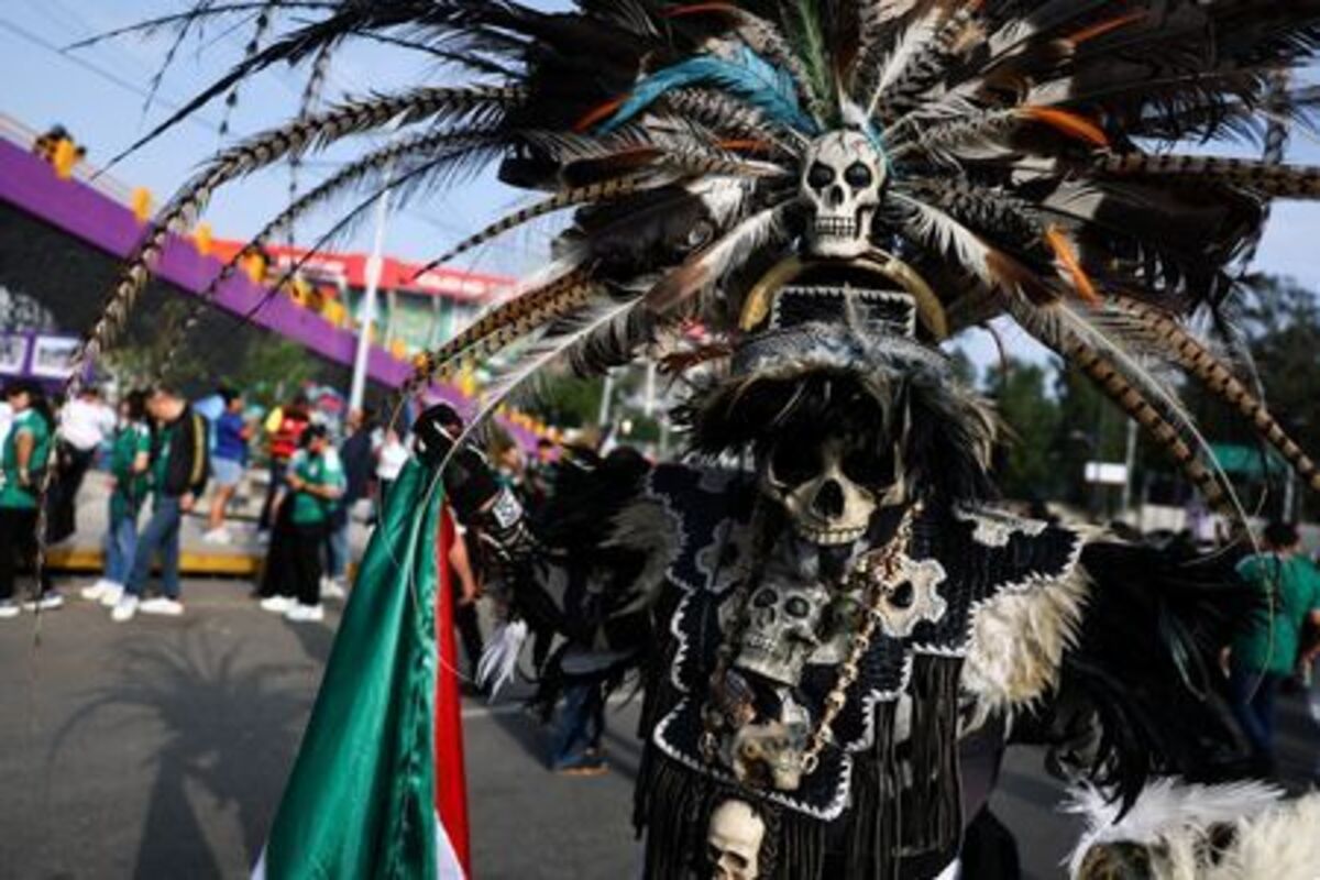 Soccer Football - FIFA World Cup 2026 - Group A - Mexico v South Africa - Estadio Azteca, Mexico City, Mexico - June 11, 2026 Mexico fan poses for a photograph outside the stadium before the match REUTERS/Kai Pfaffenbach