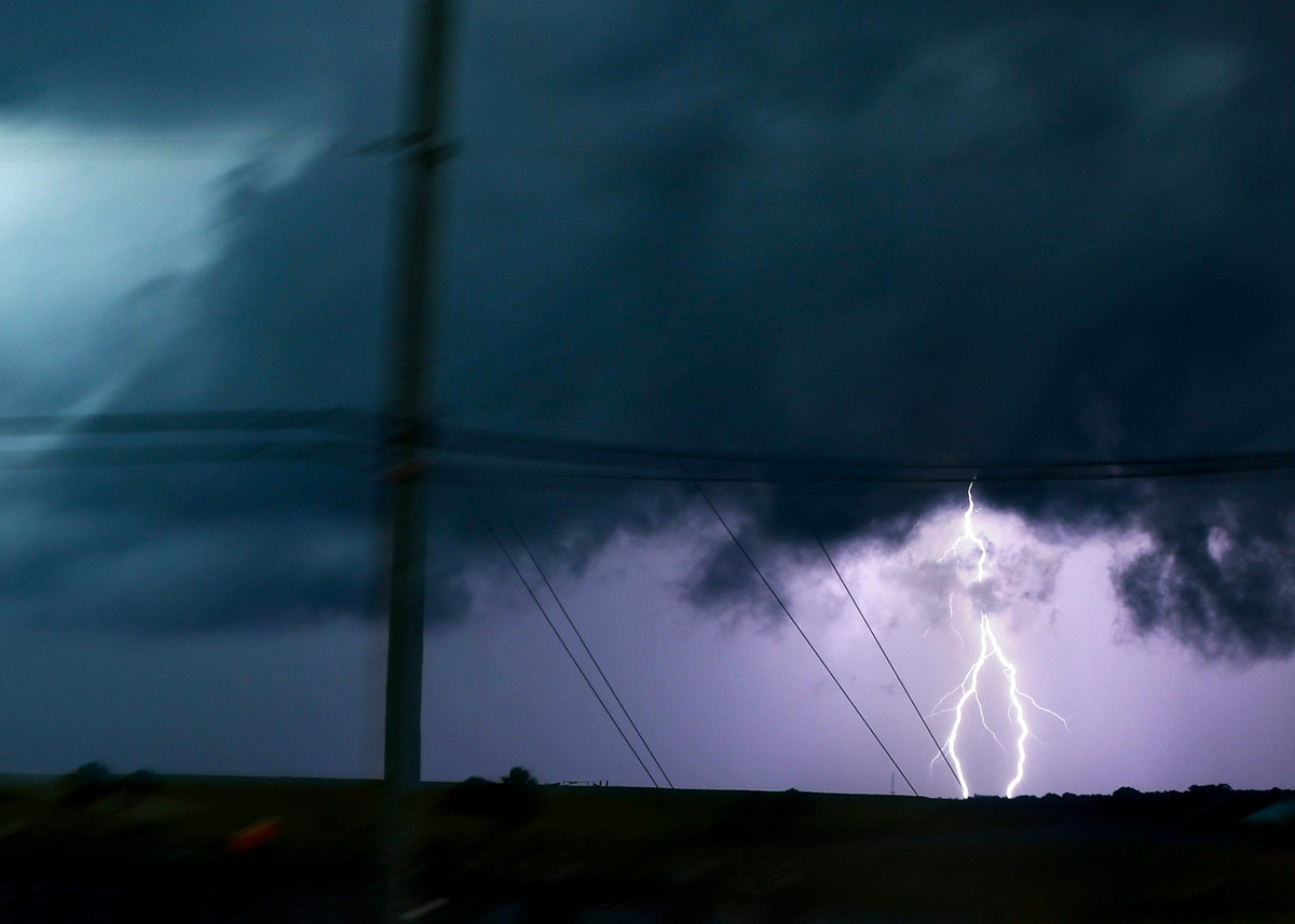 Lightning lights up the sky as a severe thunderstorm moves over Lake Okeechobee at the Port Mayaca Lock and Dam on June 24, 2026, in Martin County.