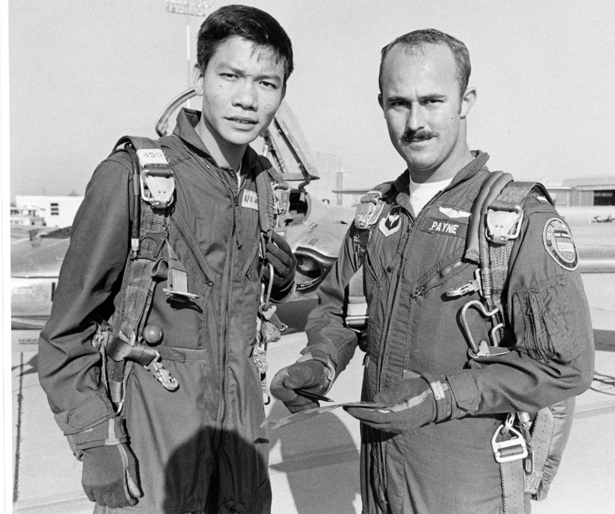 A South Vietnamese student pilot with his USAF training officer during the Vietnam War. Undated photograph.