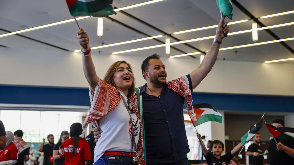 Rawan Hamati, left, and her husband Laith Madain, from San Diego, cheer as they gather before the start of “Jordan House San Jose; Official Fan and Cultural Experience Celebrating Jordan's First-Ever FIFA World Cup Appearance” at the San Jose Convention Center in downtown San Jose, Calif., on Sunday, June 21, 2026. (Nhat V. Meyer/Bay Area News Group)
