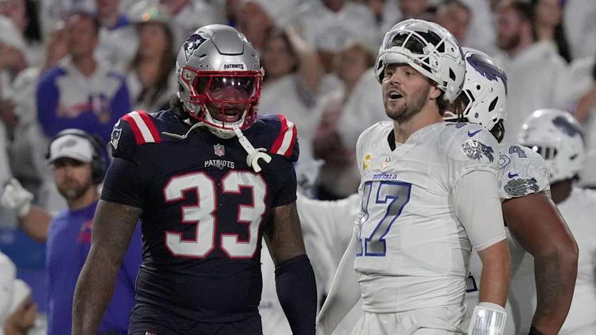  Buffalo Bills quarterback Josh Allen reacts to a play during second half action at at Highmark Stadium in Orchard Park on Oct. 5, 2025. Besides him, New England Patriots linebacker Anfernee Jennings watches. | Tina MacIntyre-Yee/Democrat and Chronicle / USA TODAY NETWORK via Imagn Images 