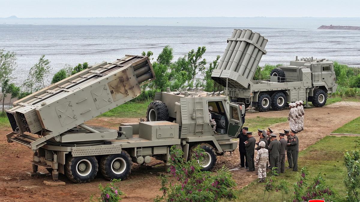North Korean leader Kim Jong Un oversees test launches of a mix of tactical ballistic missiles, artillery rockets and precision cruise missiles at an undisclosed location in North Korea on Tuesday.