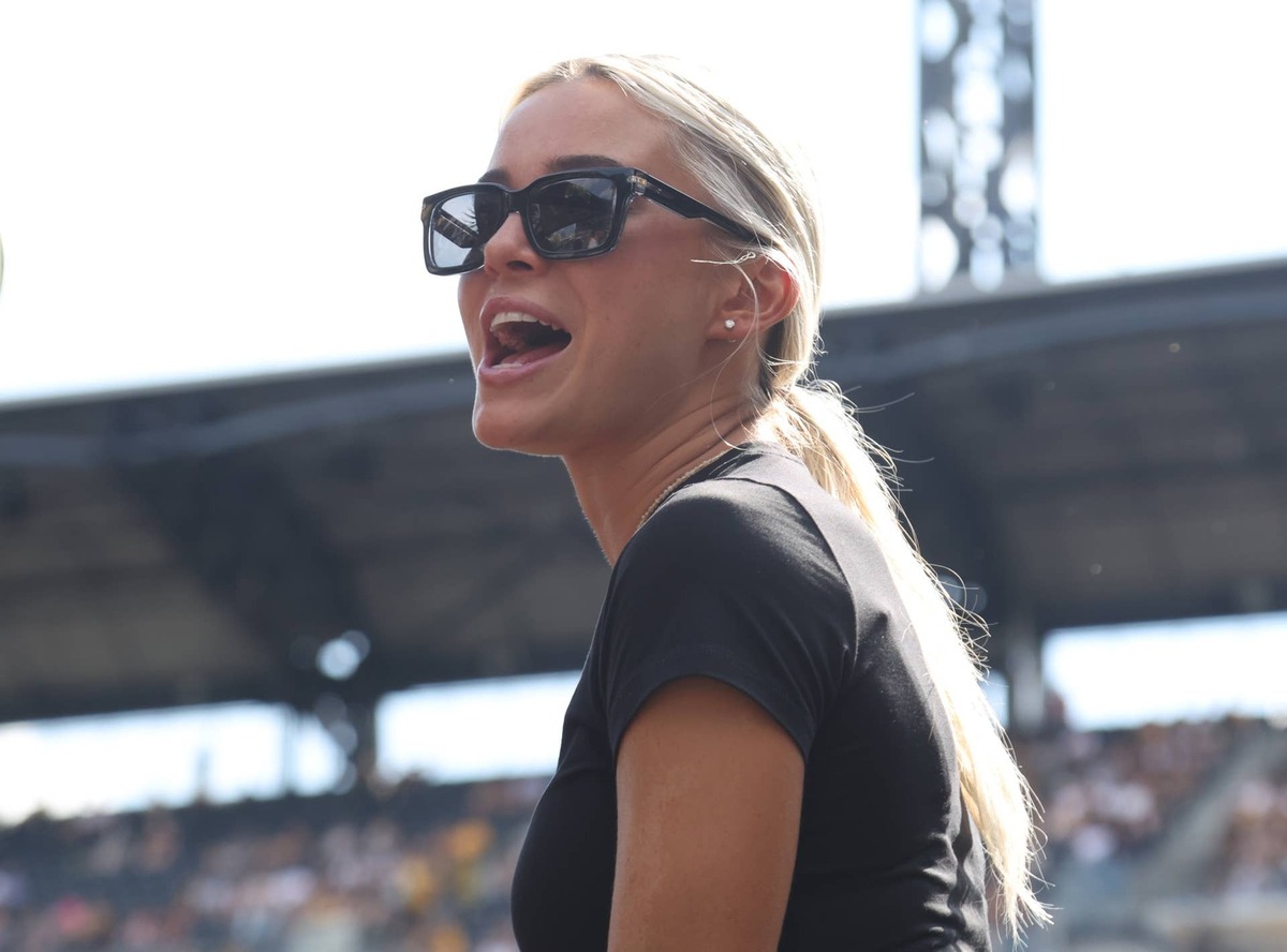  Jul 12, 2026; Pittsburgh, Pennsylvania, USA; Social media influencer and actress Livvy Dunne sings along as Country music recording artist Jordan Davis (not pictureD) performs a post-game concert after the Pittsburgh Pirates defeated the Milwaukee Brewers at PNC Park. Mandatory Credit: Charles LeClaire-Imagn Images 
