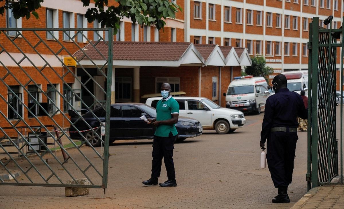 Workers stand guard at the gate of the Kibuli Muslim Hospital where a Congolese man died of Ebola Bundibugyo virus in Kibuli suburb of Kampala, Uganda May 16, 2026. REUTERS/Abubaker Lubowa