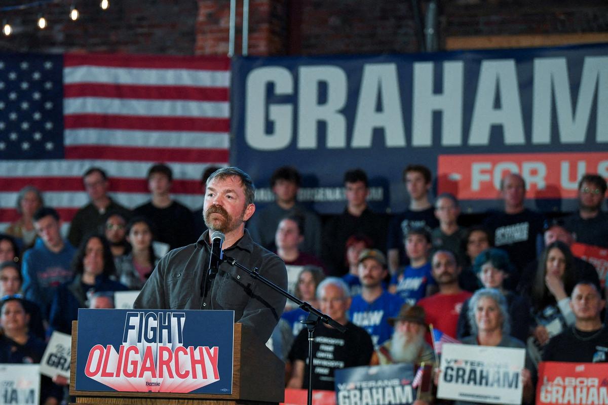 FILE PHOTO: Graham Platner, Democratic candidate for U.S. Senate in Maine, speaks during a "Fighting Oligarchy" campaign rally with U.S. Senator Bernie Sanders (I-VT) in Portland, Maine, U.S., May 25, 2026.   REUTERS/Amanda Sabga/File Photo