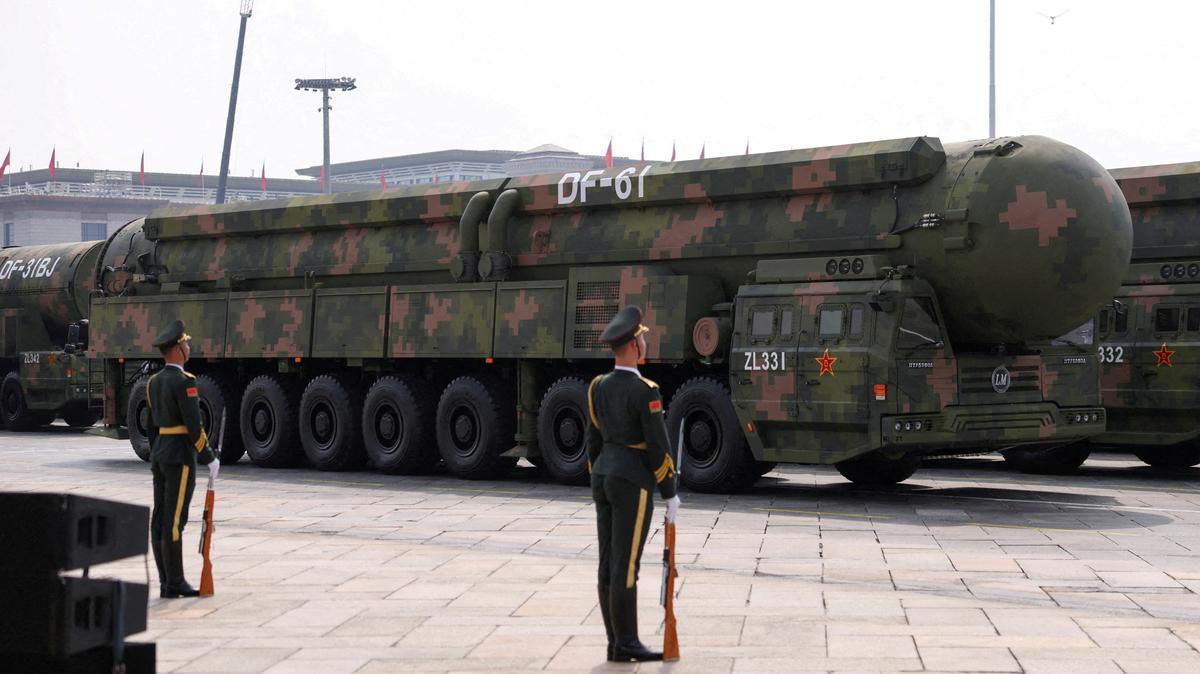 FILE PHOTO: FILE PHOTO: Members of the People's Liberation Army stand as the strategic strike group displays DF-61 nuclear missiles during a military parade  in Beijing, China, September 3, 2025. REUTERS/Tingshu Wang/File Photo/File Photo