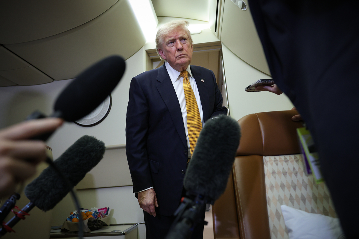 U.S. President Donald Trump speaks to members of the press for the first time aboard the new Air Force One while in flight from RAF Mildenhall AFB to Joint Base Andrews July 8, 2026 after leaving the United Kingdom. 