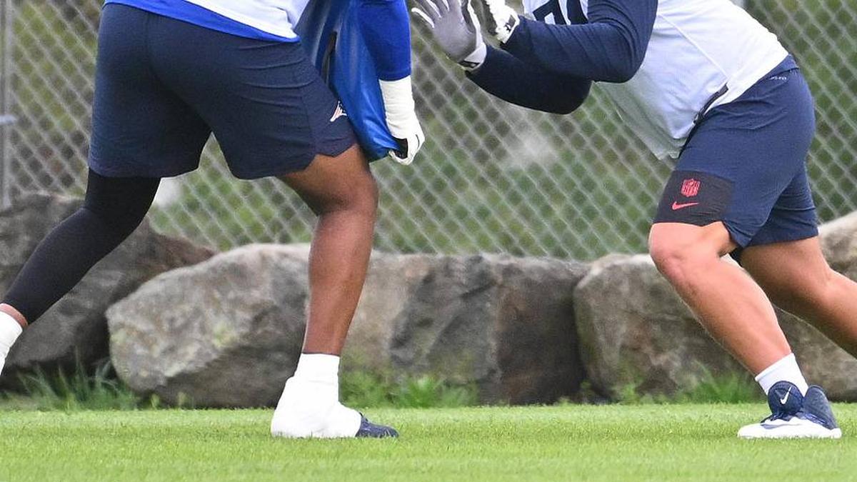  May 9, 2026; Foxborough, MA, USA; New England Patriots tackle Caleb Lomu (74) works with tackle Dametrious Crownover (68) during the New England Patriots rookie camp at Gillette Stadium. Mandatory Credit: Eric Canha-Imagn Images | Eric Canha-Imagn Images 