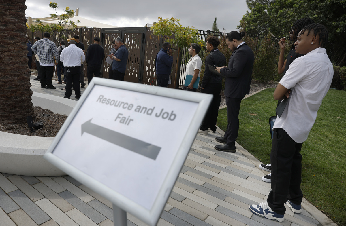  Job seekers wait in line to enter a career expo on June 30, 2026, in Carson, California. 