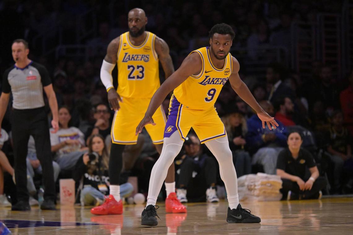  Los Angeles Lakers guard Bronny James and forward LeBron James defend on the court in the second half against the Washington Wizards at Crypto.com Arena. Jayne Kamin-Oncea-Imagn Images