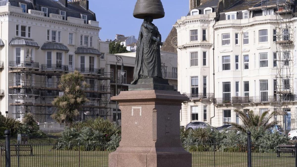 Walnut Whip model was placed on the head of a Queen Victoria statue in Warrior Square, St Leonards on Sea. (JJ Waller via SWNS). 