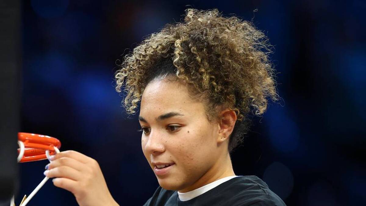  Apr 5, 2026; Phoenix, AZ, USA; UCLA Bruins guard Kiki Rice (1) cuts down the net after the National Championship game against the South Carolina Gamecocks of the women's 2026 NCAA Tournament at Mortgage Matchup Center. Mandatory Credit: Mark J. Rebilas-Imagn Images | Mark J. Rebilas-Imagn Images 