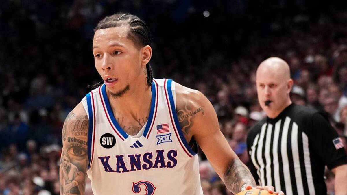  Feb 23, 2026; Lawrence, Kansas, USA; Kansas Jayhawks guard Tre White (3) dribbles the ball against the Houston Cougars during the second half of the game at Allen Fieldhouse. Mandatory Credit: Denny Medley-Imagn Images | IMAGN IMAGES via Reuters Connect 