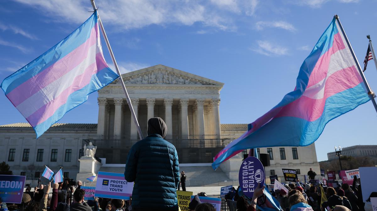 Supreme Court Reviews Transgender Athlete Bans In Landmark Case. Protesters supporting transgender athletes competing in women's sports gather outside the Supreme Court on January 13, 2026 in Washington, DC. 