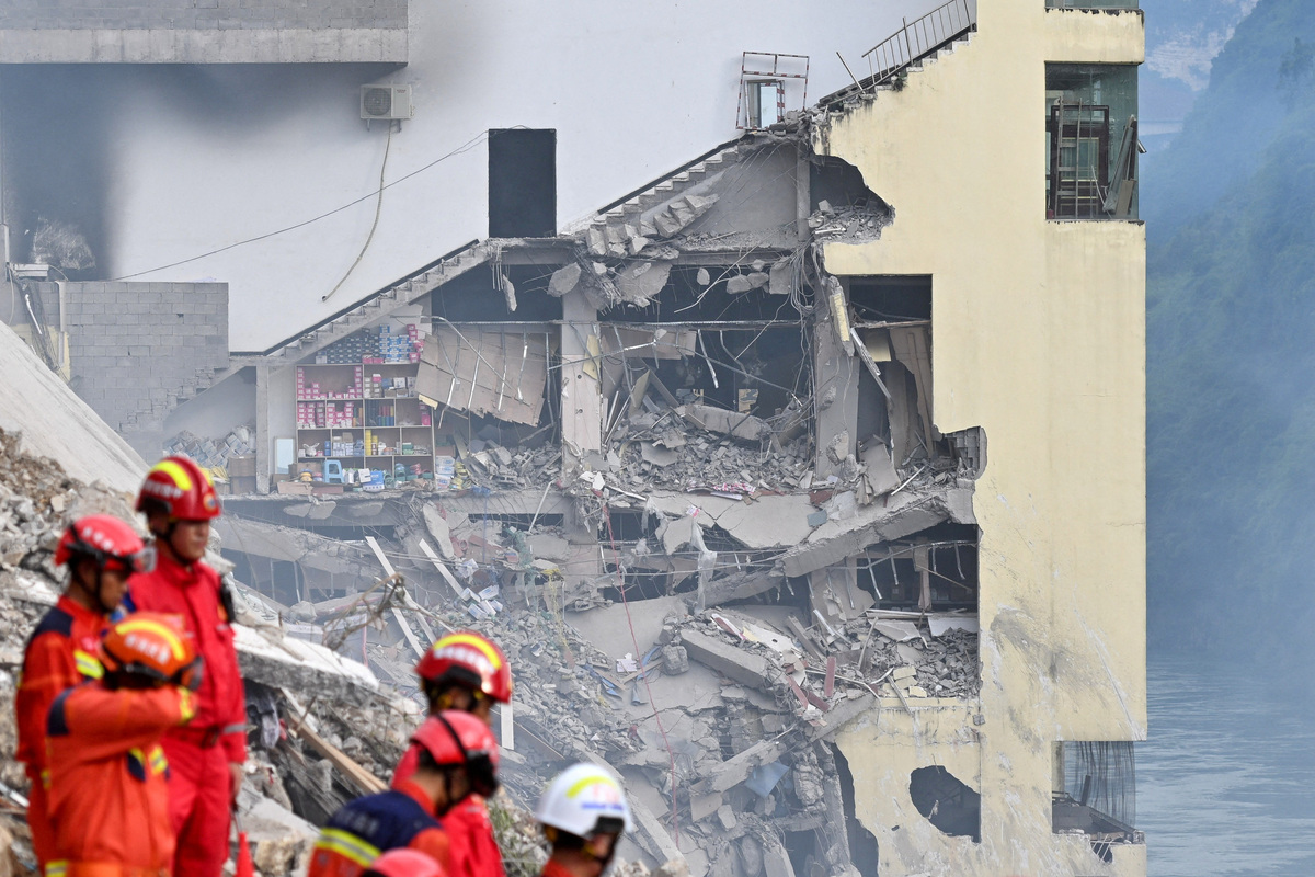 Rescue workers search for survivors at the site of a landslide along Wujiang river in Pengshui Miao and Tujia Autonomous County, Chongqing, China July 17, 2026. cnsphoto via REUTERS