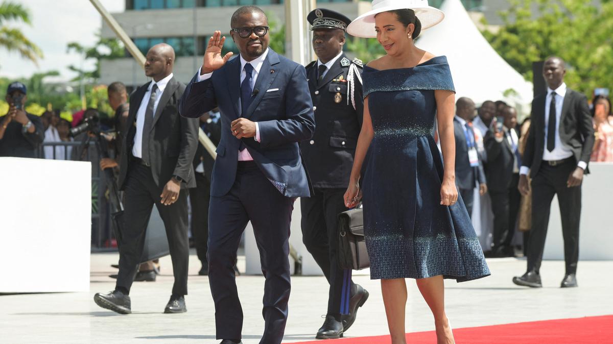Benin's newly elected President Romuald Wadagni waves as he walks next to his wife Nathalie Villette-Wadagni, during the inauguration ceremony at the Congress Palace in Cotonou, Benin, May 24, 2026. REUTERS/Charles Placide Tossou