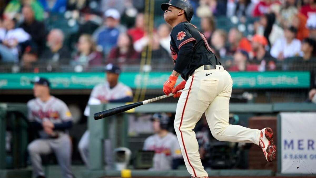Giants slugger Rafael Devers watches his solo home run during a 5-0 victory over the Braves on Saturday night.