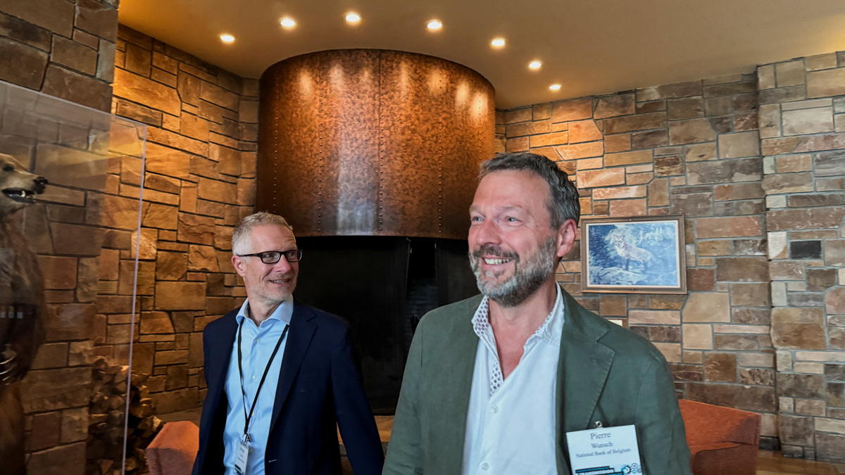 Belgian Central Bank Governor Pierre Wunsch and Slovenian Central Bank Chief Bostjan Vasle walk into the Kansas City Fed's annual economic symposium in Jackson Hole, Wyoming, U.S., August 22, 2024. REUTERS/Ann Saphir