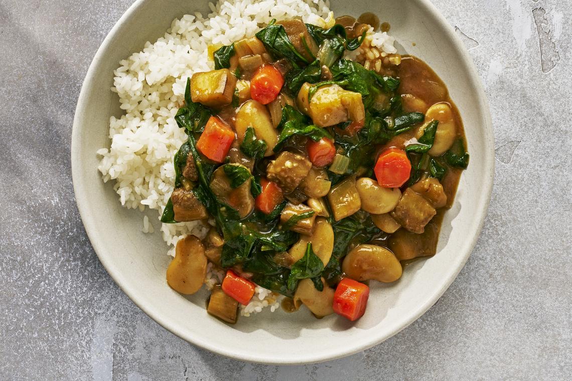 Bean and vegetable Japanese curry. Including a bean-based Japanese curry, Genevieve Ko's dan dan noodles and our very beloved chicken shawarma. Food Stylist: Barrett Washburne. (Andrew Bui/The New York Times)