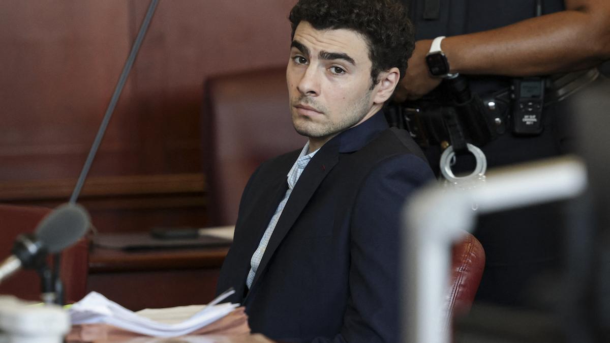 Luigi Mangione, accused of the murder of United Healthcare CEO Brian Thompson, attends a court hearing to rule on the admissibility of evidence and setting of trial date in New York, on May 18, 2026. (Photo by Jeenah Moon / POOL / AFP)