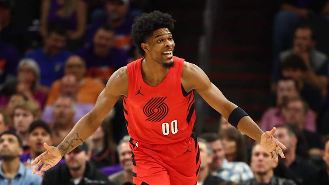  Apr 14, 2026; Phoenix, Arizona, USA; Portland Trail Blazers guard Scoot Henderson (00) reacts against the Phoenix Suns in the first half during the play-in rounds of the 2026 NBA Playoffs at Mortgage Matchup Center. | Mark J. Rebilas-Imagn Images 